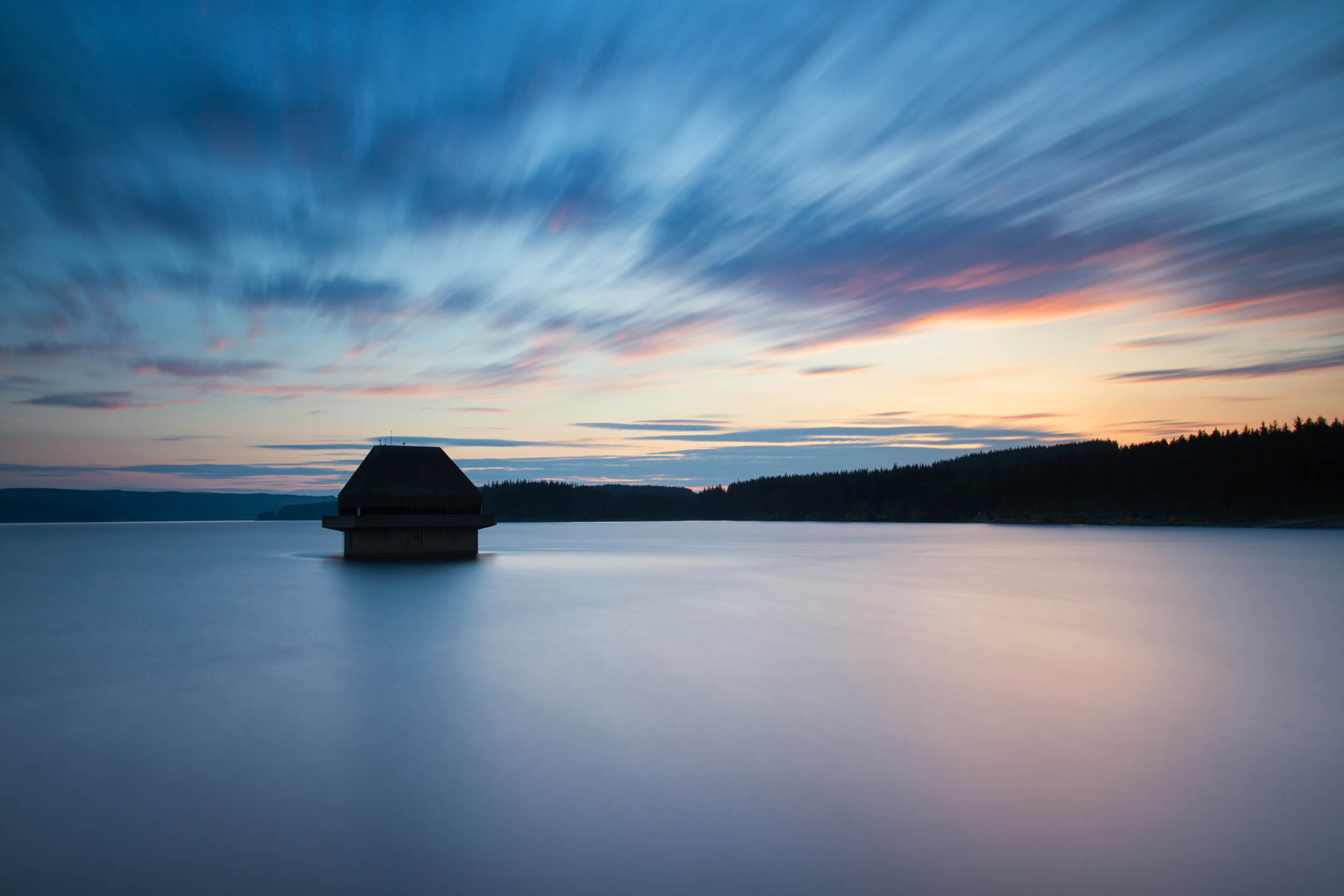 About Kielder Waterside. Over looking the Kielder reservoir at sunset